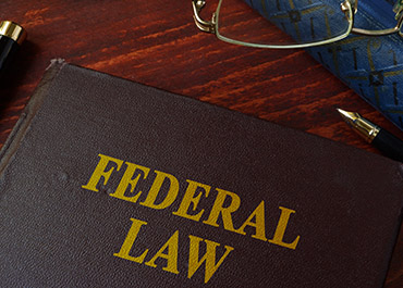 Federal law book for a target letter defense case in a Colorado criminal law practice