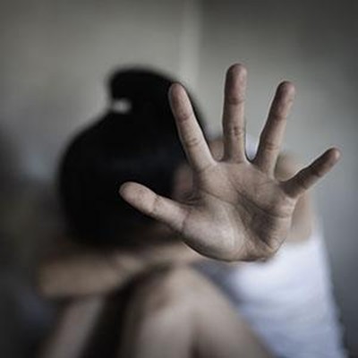 Person showing hand in distress, symbolizing protection in sex crime defense cases 
