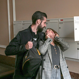 Man threatening woman near mailboxes for a violent crime legal defense.