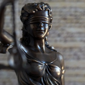 Lady Justice and the United States Constitution, representing federal criminal defense