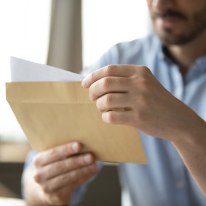 Man reading a letter received in the mail